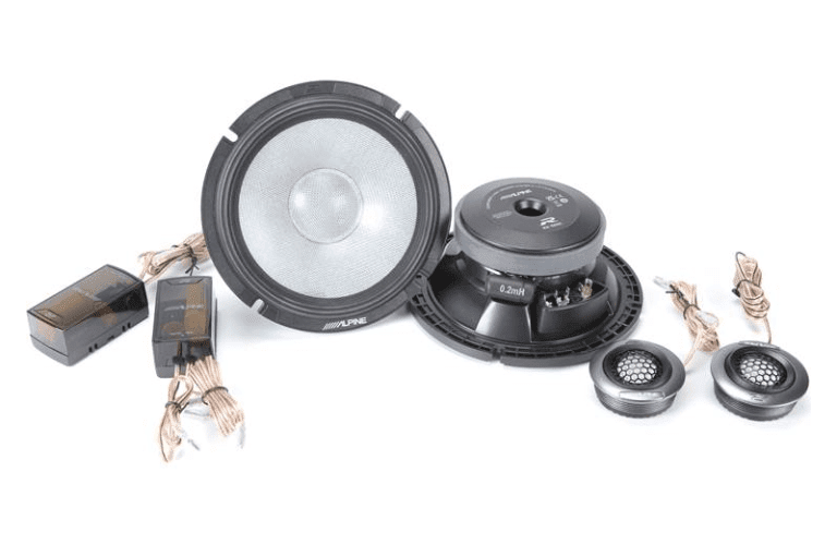 Car audio speakers and components set on display.
