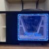 Speaker with blue LED lights and Flynn Audio logo.