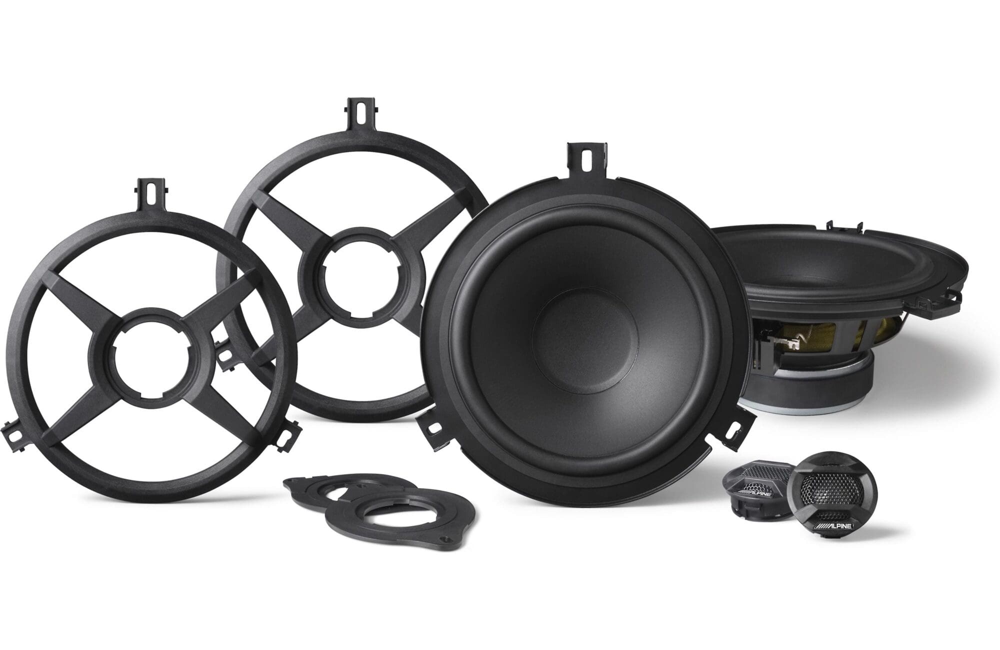 Car audio speaker components set on white background.